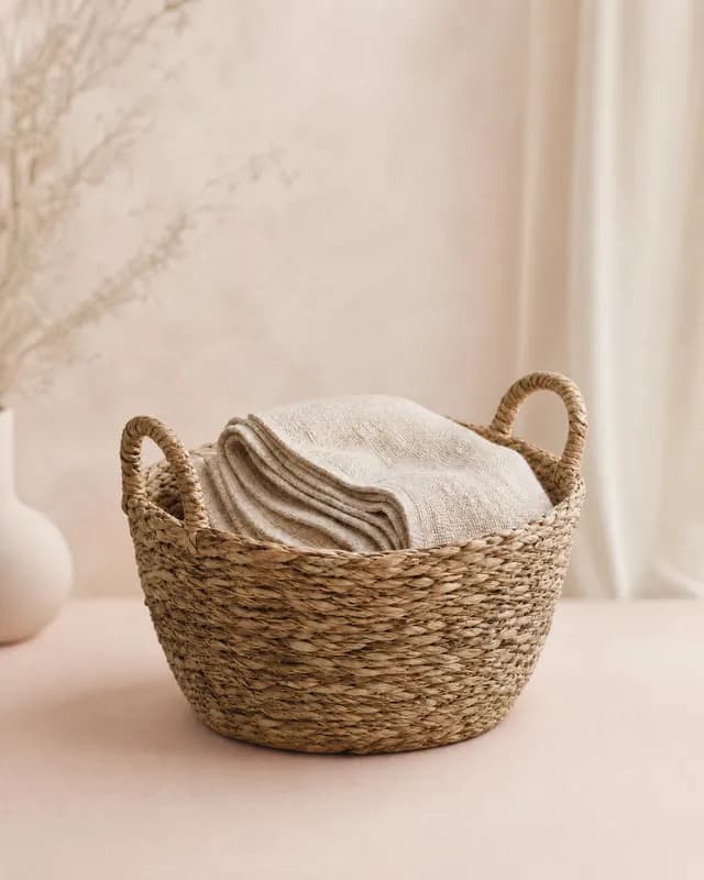 A seagrass basket with a linen throw, re-shot in Latent's Pastel gradient look